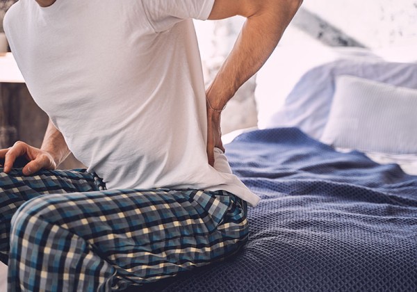 person experiencing radicular low back pain symptoms